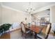 Charming dining room with hardwood floors, wainscotting and a chandelier at 907 Thorn Ridge Ln, Lake Wylie, SC 29710