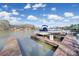 Boats on a dock with boat lifts on a beautiful lake surrounded by trees at 907 Thorn Ridge Ln, Lake Wylie, SC 29710
