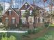 Beautiful brick home featuring classic architecture and lush landscaping at 907 Thorn Ridge Ln, Lake Wylie, SC 29710