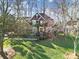 Charming two-story brick home with a well-manicured lawn and mature trees at 907 Thorn Ridge Ln, Lake Wylie, SC 29710