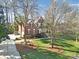 An eye-level side view of a brick home with a well-maintained lawn and curb appeal at 907 Thorn Ridge Ln, Lake Wylie, SC 29710