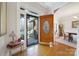 Inviting foyer featuring a wood front door with glass detail, light hardwood floors, and open sight lines at 907 Thorn Ridge Ln, Lake Wylie, SC 29710