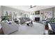 Bright living room with a fireplace, large windows, and hardwood floors at 907 Thorn Ridge Ln, Lake Wylie, SC 29710