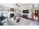 Bright living room with a fireplace, large windows, and hardwood floors at 907 Thorn Ridge Ln, Lake Wylie, SC 29710