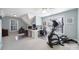 Bright and airy office space with an elliptical and multiple workstations at 907 Thorn Ridge Ln, Lake Wylie, SC 29710