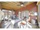 Cozy sunroom with comfortable seating and a brick wall at 907 Thorn Ridge Ln, Lake Wylie, SC 29710