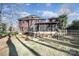 Spacious brick home featuring a screened-in porch and landscaped backyard with mature trees at 907 Thorn Ridge Ln, Lake Wylie, SC 29710