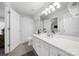 Well-lit bathroom featuring a white vanity, toilet and a separate shower area with a curtain at 907 Thorn Ridge Ln, Lake Wylie, SC 29710