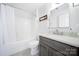 Bright, all-white bathroom featuring a shower-tub combo and vanity with modern fixtures at 907 Thorn Ridge Ln, Lake Wylie, SC 29710