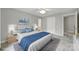 Bright bedroom featuring a ceiling fan, neutral walls, and a comfortable bed with blue accents at 907 Thorn Ridge Ln, Lake Wylie, SC 29710