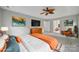 Bright bedroom featuring a ceiling fan and an orange accent chair for a cozy place to unwind at 907 Thorn Ridge Ln, Lake Wylie, SC 29710