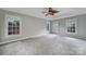 A spacious empty bedroom with multiple windows that allow plenty of natural light in at 907 Thorn Ridge Ln, Lake Wylie, SC 29710