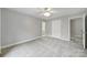 Empty bedroom with neutral walls, two doorways, and a view into the main bathroom at 907 Thorn Ridge Ln, Lake Wylie, SC 29710