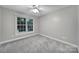 Empty bedroom with neutral walls and one large window at 907 Thorn Ridge Ln, Lake Wylie, SC 29710