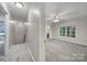 View of bedroom, adjacent bathroom, and hallway with carpet and natural lighting at 907 Thorn Ridge Ln, Lake Wylie, SC 29710