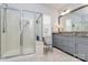 Bright bathroom with a large glass-enclosed shower, double vanity, and a neutral color palette, creating a spa-like retreat at 9119 Gander Dr, Charlotte, NC 28277
