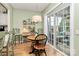 Breakfast nook with a chandelier and sliding door access to the porch at 9119 Gander Dr, Charlotte, NC 28277