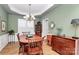 Traditional dining room featuring a wooden dining set, buffet, and natural lighting at 9119 Gander Dr, Charlotte, NC 28277