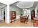 Formal dining room featuring a decorative chandelier, wainscoting, and a dining table at 9119 Gander Dr, Charlotte, NC 28277