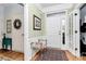 Inviting foyer features a light green color scheme, a wooden bench, and beautiful hardwood flooring at 9119 Gander Dr, Charlotte, NC 28277
