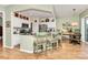 Open-concept kitchen with a breakfast bar, stainless steel appliances, and view of the breakfast nook at 9119 Gander Dr, Charlotte, NC 28277