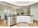 Open kitchen with granite countertops, stainless steel appliances, and a view to the living room at 9119 Gander Dr, Charlotte, NC 28277
