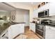 Kitchen with stainless steel appliances, granite countertops, and an opening into the breakfast nook at 9119 Gander Dr, Charlotte, NC 28277