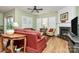 Cozy living room featuring a fireplace, comfortable seating, and lots of natural light at 9119 Gander Dr, Charlotte, NC 28277