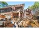 Spacious brick home featuring a large patio with stone accents and a beautiful waterfall feature into the yard at 9135 Fair Oak Dr, Sherrills Ford, NC 28673