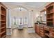 Spacious bathroom features a soaking tub with decorative windows, columns, sconces, and custom cabinetry at 9135 Fair Oak Dr, Sherrills Ford, NC 28673