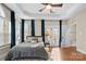 Tranquil bedroom with tray ceilings, hardwood floors, and natural light at 9135 Fair Oak Dr, Sherrills Ford, NC 28673
