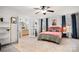 Stylish bedroom with an ensuite bathroom, floral wallpaper, and a plush rug exudes comfort and sophistication at 9135 Fair Oak Dr, Sherrills Ford, NC 28673