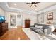 Bright bedroom features hardwood floors, a sitting area, and a king-size bed for a relaxing and comfortable retreat at 9135 Fair Oak Dr, Sherrills Ford, NC 28673