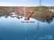 A private boat dock with multiple slips, offering direct water access and a waterfront living experience at 9135 Fair Oak Dr, Sherrills Ford, NC 28673