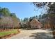 Beautiful brick home with a circular driveway and a well-maintained lawn at 9135 Fair Oak Dr, Sherrills Ford, NC 28673