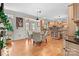 Eat-in kitchen features hardwood floors, light wood cabinets, an island, and French doors at 9135 Fair Oak Dr, Sherrills Ford, NC 28673