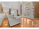 Sun-filled living room with soaring windows, hardwood floors, neutral sofas, and a seamless flow for entertaining and relaxation at 9135 Fair Oak Dr, Sherrills Ford, NC 28673