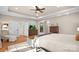 Bright bedroom with tray ceilings, hardwood floors, natural light, and neutral decor at 9135 Fair Oak Dr, Sherrills Ford, NC 28673