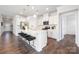 Modern kitchen with white cabinets, stainless steel appliances, and a large island at 103 Noah Ln, Troutman, NC 28166