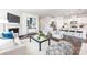 Open-concept living room connecting to a modern kitchen with stainless steel appliances at 103 Noah Ln, Troutman, NC 28166