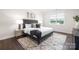 Bedroom featuring natural light, neutral color scheme, a stylish rug, and coordinated decor at 103 Noah Ln, Troutman, NC 28166