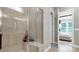 Contemporary bathroom with a glass-enclosed shower and a neutral color palette, adjacent to the main bedroom at 1043 Rabbit Hill Ln, Monroe, NC 28110