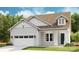 Charming single-Gathering home featuring a 2-car garage, dormer, and manicured lawn at 1043 Rabbit Hill Ln, Monroe, NC 28110