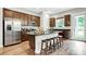 Well-equipped kitchen with a central island, stainless steel refrigerator, and stylish bar stool seating at 1043 Rabbit Hill Ln, Monroe, NC 28110