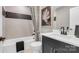 Modern bathroom featuring white countertops, sleek black fixtures, and decorative tile accents at 1047 Rabbit Hill Ln, Monroe, NC 28110