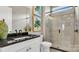 Beautiful bathroom featuring tiled shower with glass door, granite countertop, and stylish decor at 1047 Rabbit Hill Ln, Monroe, NC 28110