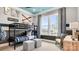 bedroom featuring airplane-themed decor, a bunk bed, playful accents, and an oversized window at 1047 Rabbit Hill Ln, Monroe, NC 28110