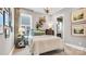Cozy bedroom with a plush bed, decorative shelving, and soft natural light at 1047 Rabbit Hill Ln, Monroe, NC 28110
