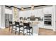Beautiful kitchen with an island, granite countertops, stainless steel appliances, and modern pendant lights at 1047 Rabbit Hill Ln, Monroe, NC 28110