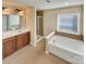 Bathroom features a soaking tub, separate shower, and dual vanity at 1062 Baldwin Dr, Lancaster, SC 29720